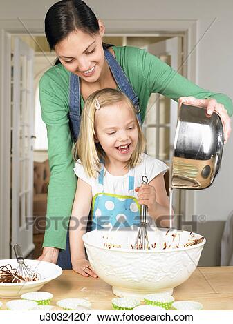 Mother and daughter cooking View Large Photo Image Stock Photo - Mother and daughter cooking. Fotosearch