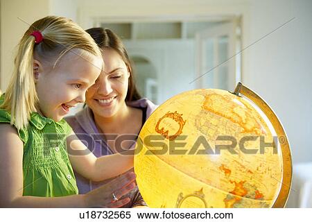 Stock Photography - Mother and daughter exploring the world. Fotosearch