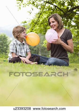 Mother And Son With Balloons View Large Photo Image Stock Photo - Mother And Son With Balloons. Fotosearch