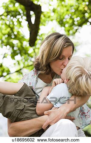 Mother Kissing Son View Large Photo Image Stock Image - Mother Kissing Son. Fotosearch