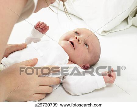 Mother playing with her baby View Large Photo Image Stock Photo - Mother playing with her baby. Fotosearch