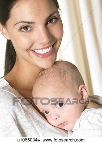 Mother with her baby-boy, smiling View Large Photo Image Picture - Mother with her baby-boy, smiling. Fotosearch