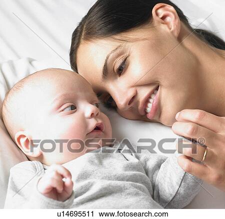 Mother with her baby-boy, smiling View Large Photo Image Stock Image - Mother with her baby-boy, smiling. Fotosearch