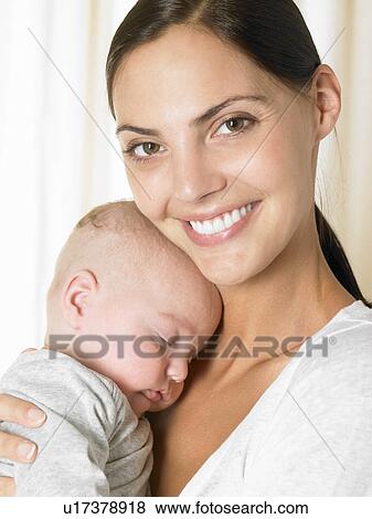 Stock Photo - Mother with her baby-boy, smiling. Fotosearch