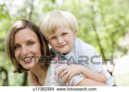 Picture - Mother With Son piggyback. Fotosearch