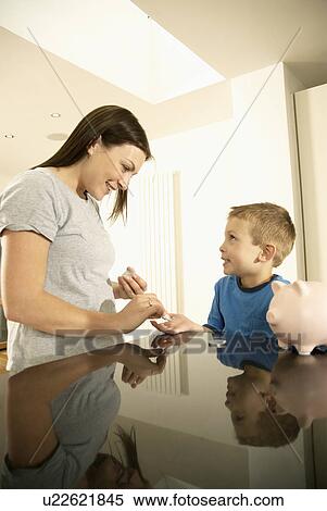 mum handing boy money View Large Photo Image Stock Photography - mum handing boy money. Fotosearch