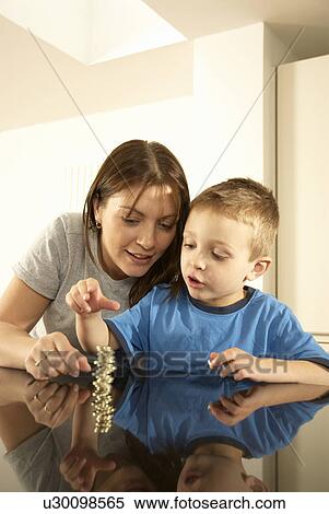 mum with son and money View Large Photo Image Stock Photography - mum with son and money. Fotosearch