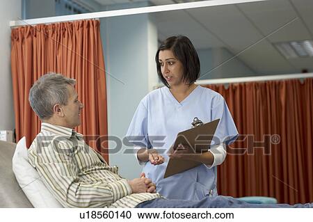Nurse talking to patient View Large Photo Image Stock Image - Nurse talking to patient. Fotosearch