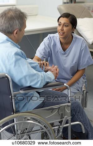 Nurse with patient in wheelchair View Large Photo Image Stock Photo - Nurse with patient in wheelchair. Fotosearch