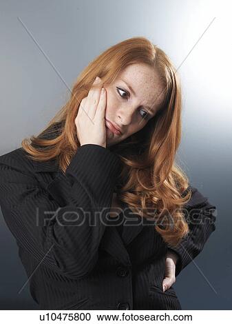 Office worker looking thoughtful View Large Photo Image Stock Image - Office worker looking thoughtful. Fotosearch