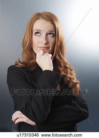 Office worker looking thoughtful View Large Photo Image Stock Photograph - Office worker looking thoughtful. Fotosearch