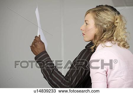 office workers reading papers View Large Photo Image Stock Image - office workers reading papers. Fotosearch