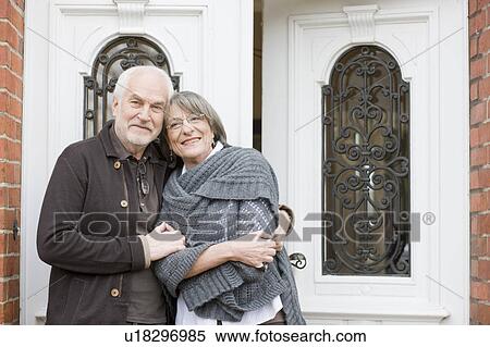 old couple standing at front door View Large Photo Image Stock Photography - old couple standing at front door. Fotosearch