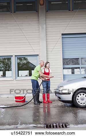 old man and young girl washing car View Large Photo Image Stock Image - old man and young girl washing car. Fotosearch
