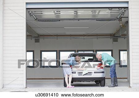 old man and young girl washing car View Large Photo Image Stock Image - old man and young girl washing car. Fotosearch