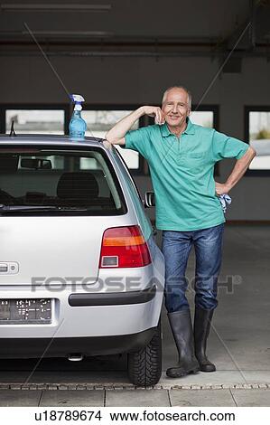 old man next to car with cleaning kit View Large Photo Image Picture - old man next to car with cleaning kit. Fotosearch