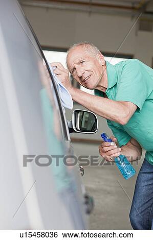 Stock Photograph - old man washing car. Fotosearch