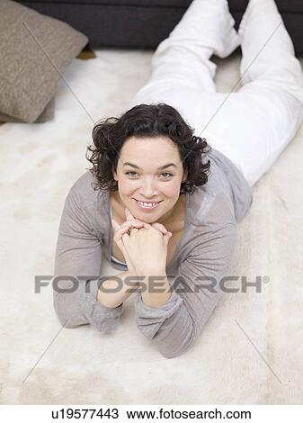 One woman relaxing on the floor. View Large Photo Image Stock Image - One woman relaxing on the floor.. Fotosearch