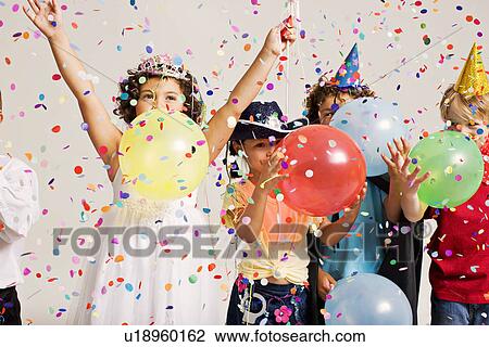 party kids blowing balloons View Large Photo Image Stock Image - party kids blowing balloons. Fotosearch
