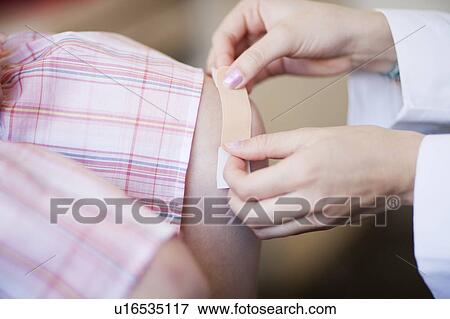 Plaster/bandage put on knee, close up View Large Photo Image Stock Photo - Plaster/bandage put on knee, close up. Fotosearch