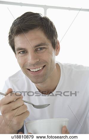 Portrait of a man holding a bowl. View Large Photo Image Stock Photo - Portrait of a man holding a bowl.. Fotosearch