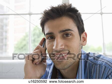 Portrait of a man using a mobile phone. View Large Photo Image Stock Image - Portrait of a man using a mobile phone.. Fotosearch