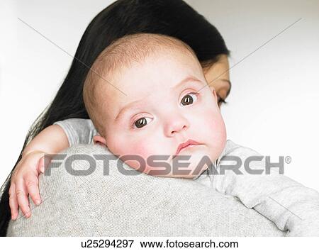 Stock Photo - Portrait of a mother with her baby. Fotosearch