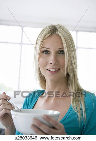 Portrait of woman holding a bowl. View Large Photo Image Stock Photograph - Portrait of woman holding a bowl.. Fotosearch