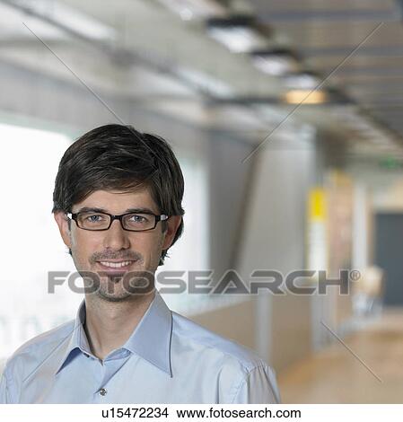 Portrait of young Businessman, close up View Large Photo Image Picture - Portrait of young Businessman, close up. Fotosearch