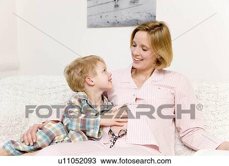 pregnant woman and boy laughing View Large Photo Image Stock Image - pregnant woman and boy laughing. Fotosearch