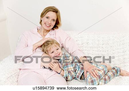 pregnant woman and boy laughing View Large Photo Image Stock Photo - pregnant woman and boy laughing. Fotosearch