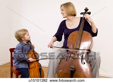 pregnant woman and boy playing Cello View Large Photo Image Stock Image - pregnant woman and boy playing Cello. Fotosearch
