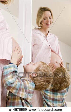 Stock Photo - pregnant woman and boy with mirror. Fotosearch