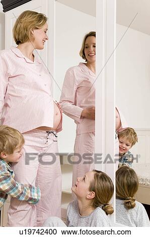 pregnant woman, girl and boy, mirror View Large Photo Image Stock Image - pregnant woman, girl and boy, mirror. Fotosearch