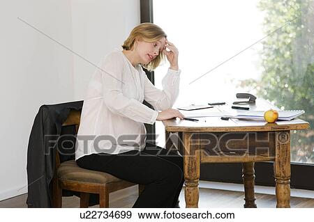 pregnant woman working in home office View Large Photo Image Stock Photo - pregnant woman working in home office. Fotosearch