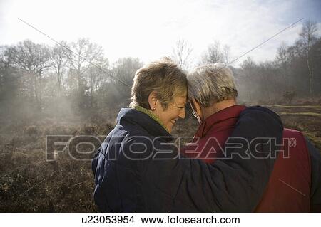 Retired Couple Hugging View Large Photo Image Picture - Retired Couple Hugging. Fotosearch