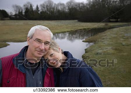 Stock Photograph - Retired Couple Smiling at Camera. Fotosearch