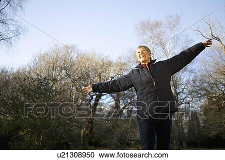 Retired Woman in Forest View Large Photo Image Stock Image - Retired Woman in Forest. Fotosearch