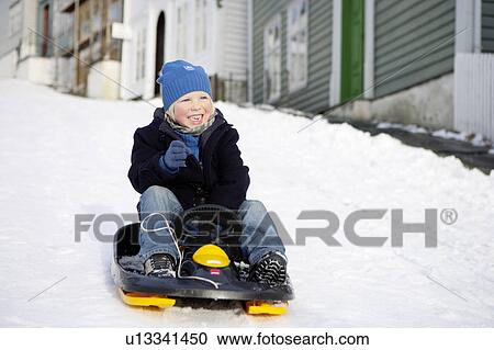Scandinavian boy on a sled View Large Photo Image Stock Image - Scandinavian boy on a sled. Fotosearch