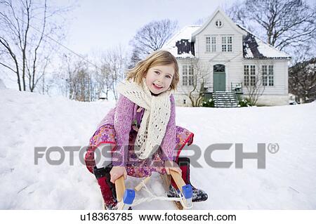 Scandinavian girl on a sled View Large Photo Image Stock Photography - Scandinavian girl on a sled. Fotosearch