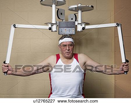 senior male exercising at gym View Large Photo Image Stock Photo - senior male exercising at gym. Fotosearch