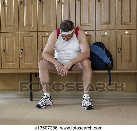 Stock Photograph - senior man in changing room at gym. Fotosearch