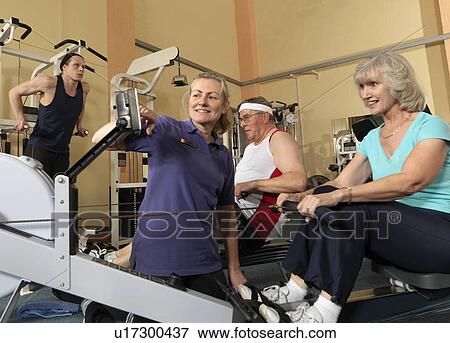 seniors training at gym with instructor View Large Photo Image Stock Photo - seniors training at gym with instructor. Fotosearch
