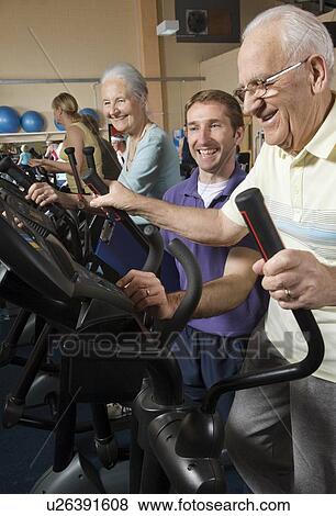 seniors training at gym with instructor View Large Photo Image Stock Photo - seniors training at gym with instructor. Fotosearch