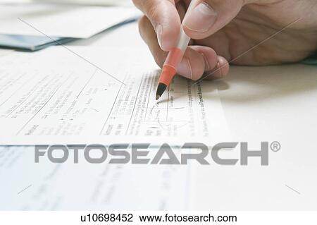 Signing a IRS tax form View Large Photo Image Stock Image - Signing a IRS tax form. Fotosearch