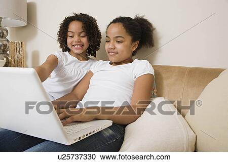 Sisters at work View Large Photo Image Stock Image - Sisters at work. Fotosearch