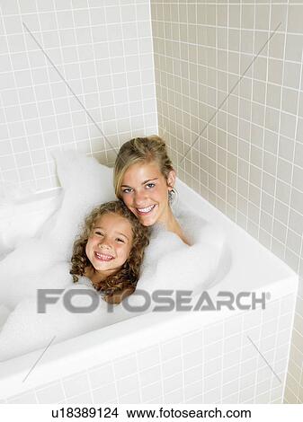 Sisters in a bath, foam View Large Photo Image Picture - Sisters in a bath, foam. Fotosearch