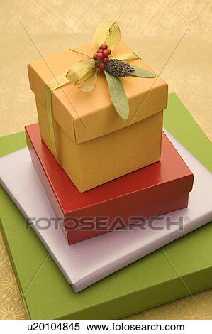 Stack of wrapped present boxes View Large Photo Image Stock Photography - Stack of wrapped present boxes. Fotosearch