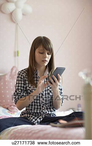 Teenage girl doing homework View Large Photo Image Stock Photo - Teenage girl doing homework. Fotosearch