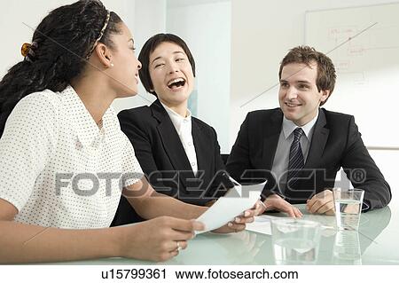 Three colleagues laughing View Large Photo Image Stock Image - Three colleagues laughing. Fotosearch